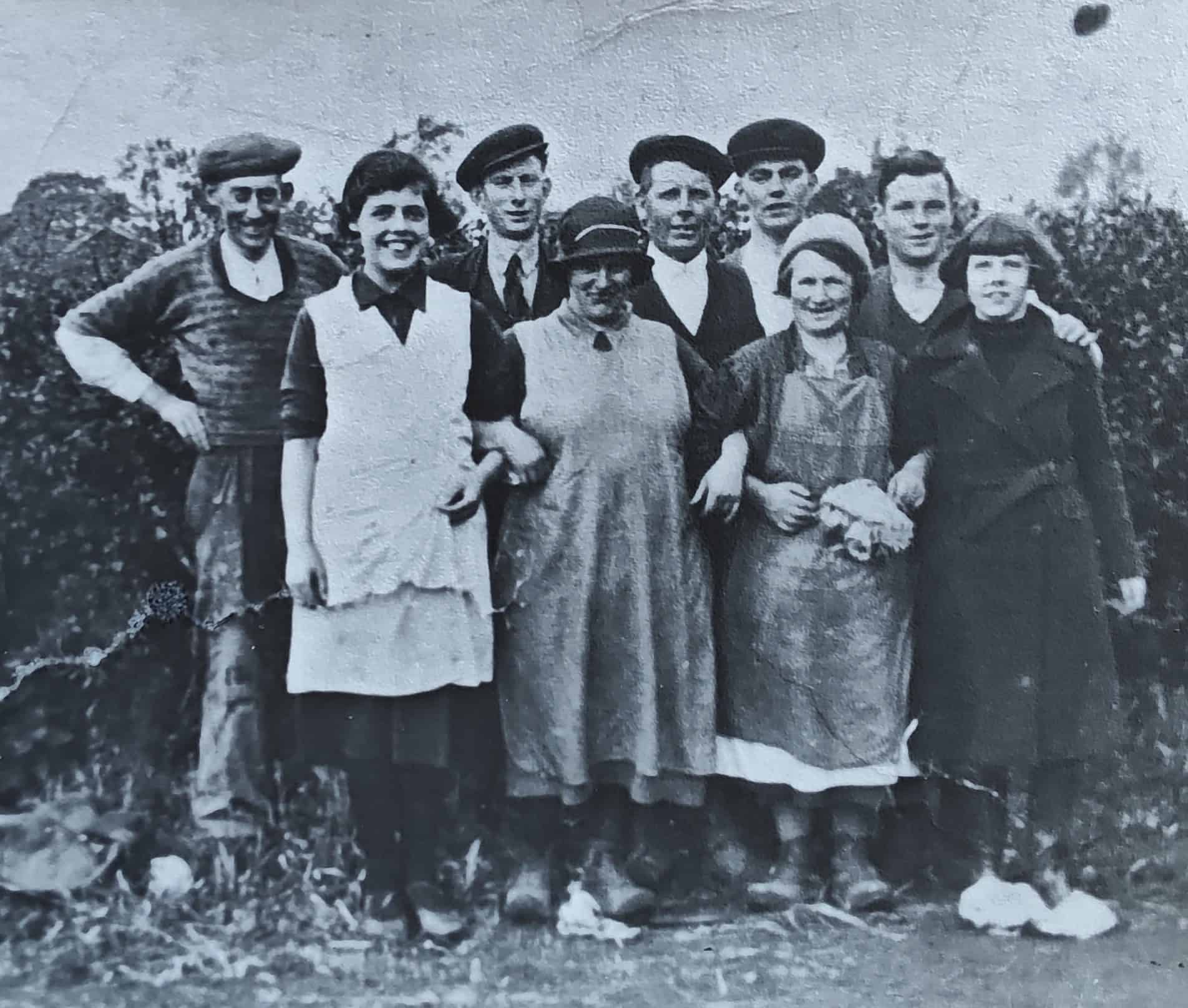Historical black and white photo of nursery staff outdoors.